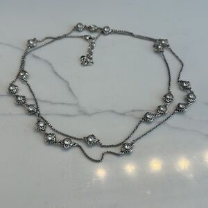 Brighton necklace. 44 inch silver tone chain with 21 sparkly 4-petal flowers.